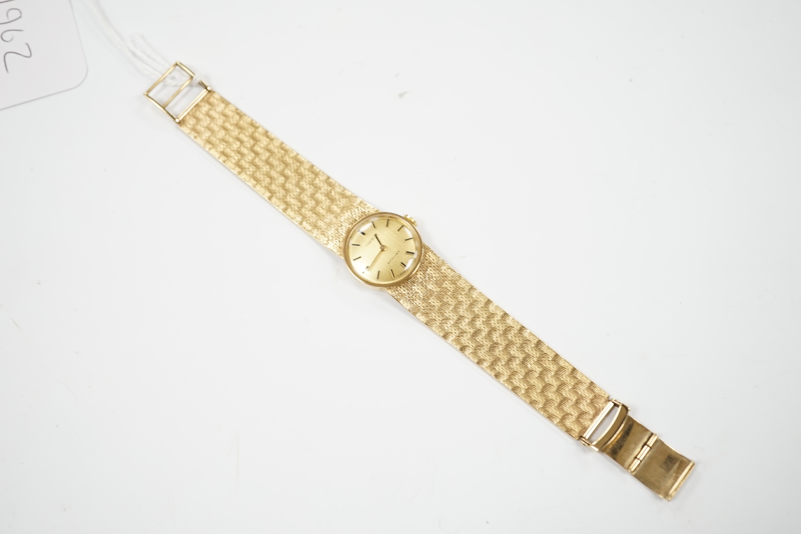 A lady's modern 9ct gold Tissot Stylist manual wind bracelet wrist watch, overall 16.5cm, gross weight 29.1 grams.